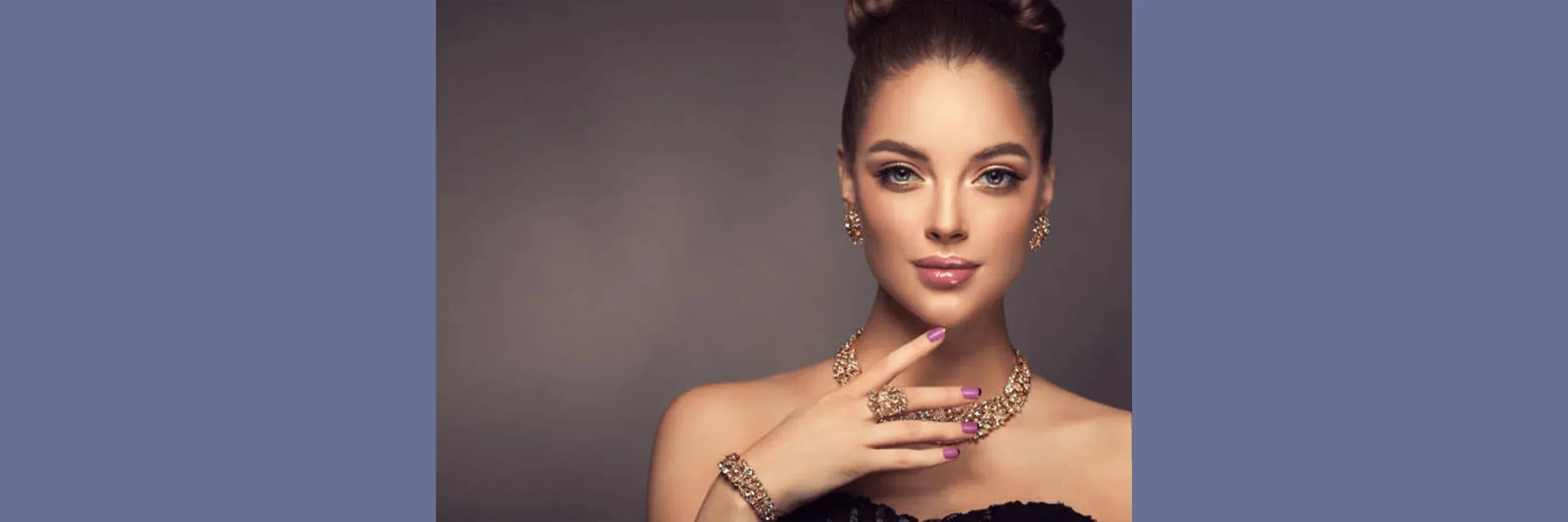 Elegant woman wearing gold-plated jewelry set with necklace, earrings, and bracelet