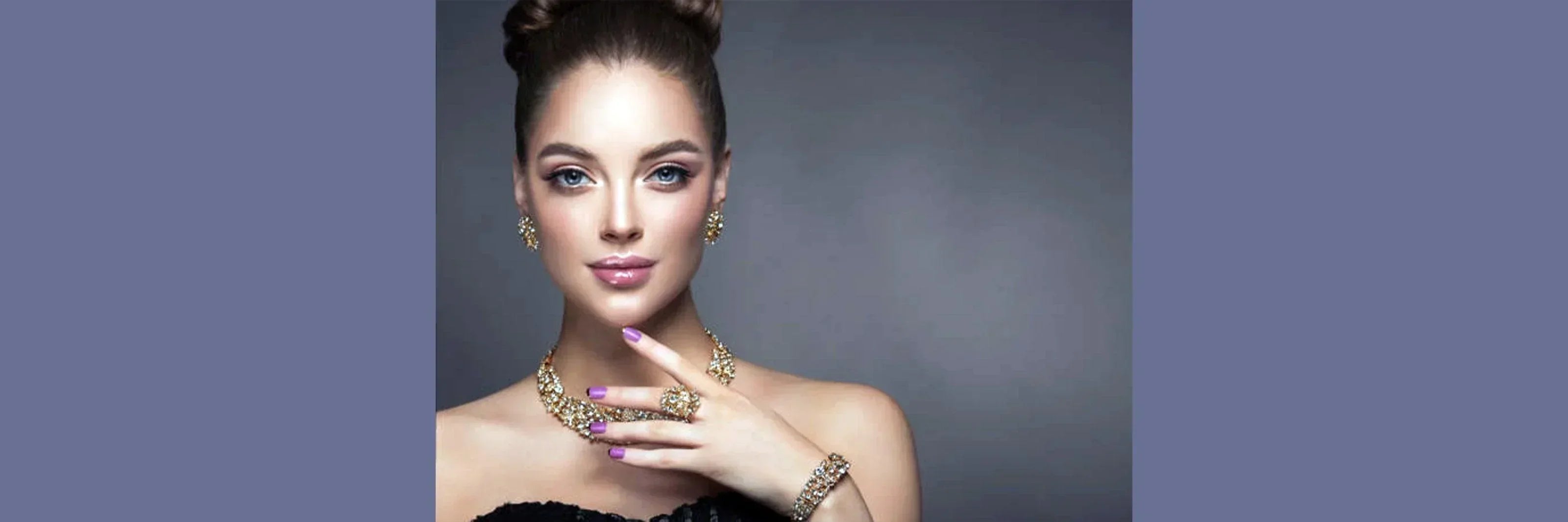 Elegant woman wearing 18K gold-plated necklace, earrings, and ring with gemstone accents