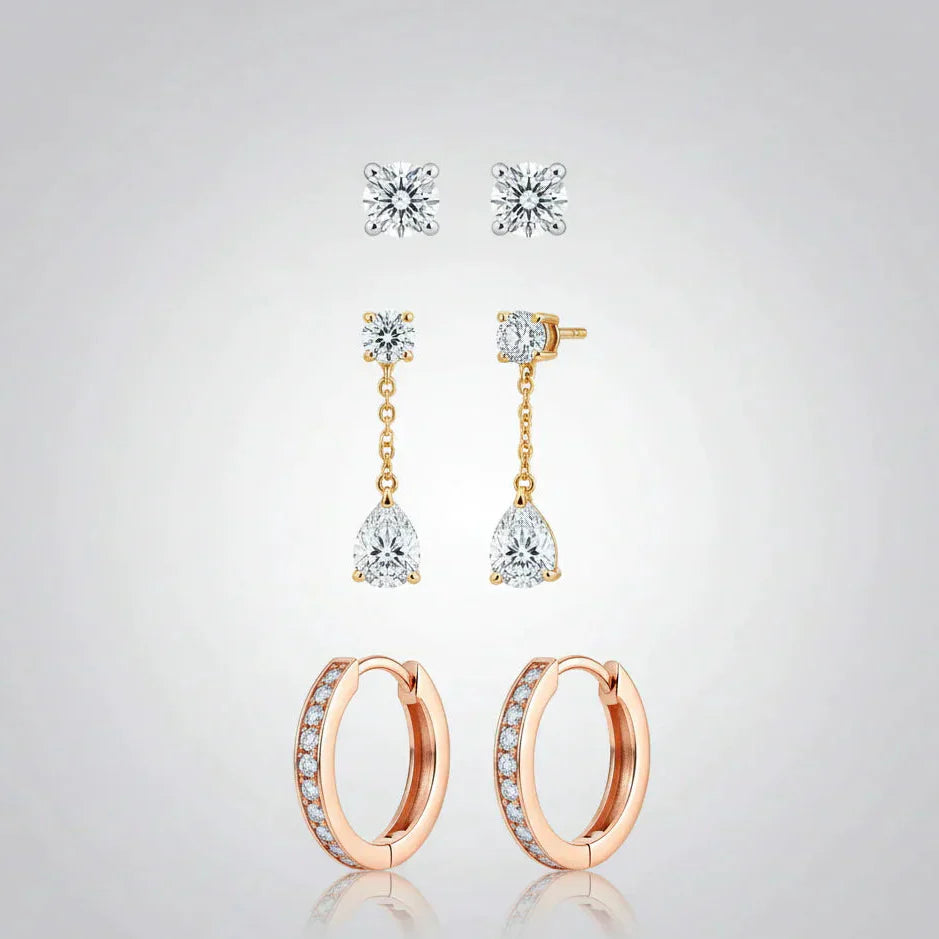 Set of three pairs of women's earrings: diamond studs, gold drop earrings, and rose gold hoops.
