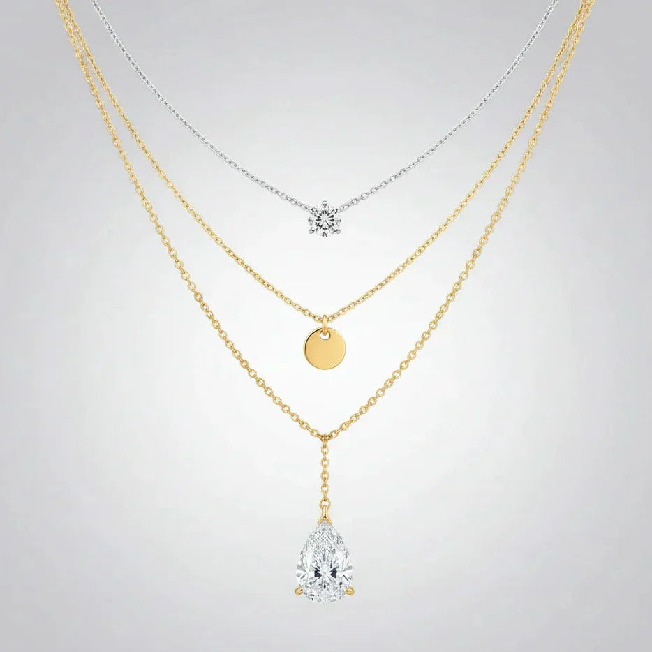 A quality-crafted layered pendant necklace set from the TM & Co. Jewels collection, featuring delicate chains and brilliant stone accents.