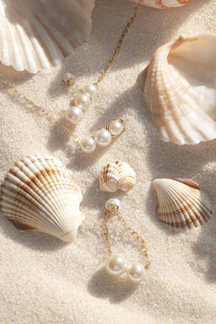 Ethically sourced pearl necklaces and bracelets on seashells and sand – TM & Co Jewels