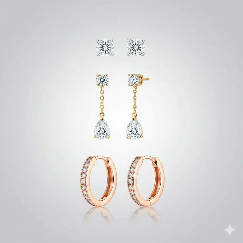 Find Your Earrings Size- Set of diamond earrings on a light gray background.