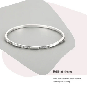 Elegant 925 silver bangle bracelet with synthetic cubic zirconia stones, minimalist design