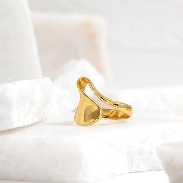 18K gold-plated abstract statement ring with modern sculptural design on white background