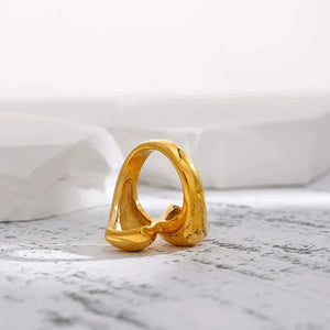 18K gold-plated sculptural open ring for women on white stone background