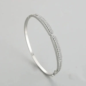 Silver Ava Heart Bands - TM & CO. JEWELS - Clear stones on a light gray background.