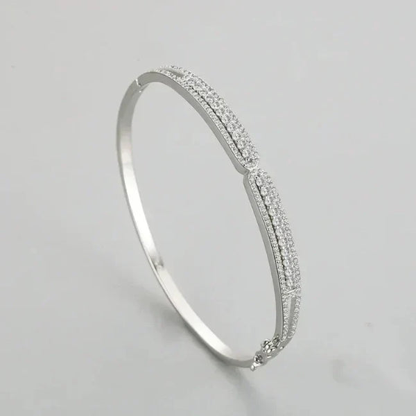 Silver Ava Heart Bands - TM & CO. JEWELS - Clear stones on a light gray background.