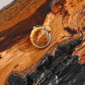 18K gold-plated and 925 silver ring with organic design on textured wood background