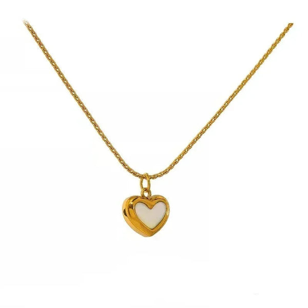Gold-plated heart pendant necklace with white enamel on a delicate chain, elegant jewelry