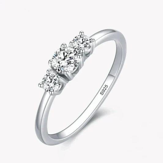 Sterling silver ring with three round clear stones on a simple band, jewelry for women