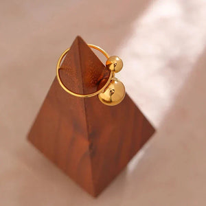 18K gold-plated ring with two polished sphere accents on white background - TM & CO. JEWELS 
