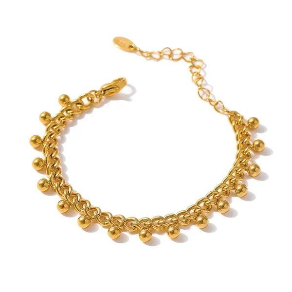 Gold chain bracelet on a white background