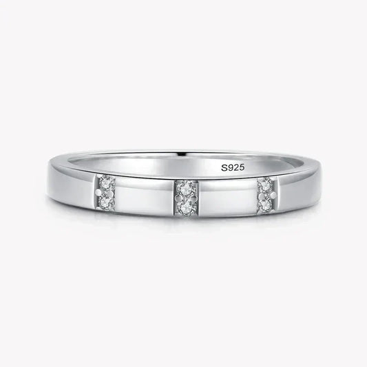 Sterling silver 925 ring with three sets of small clear gemstones, minimalist design