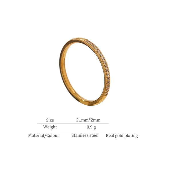 Slim gold-plated stainless steel ring with small clear stones, size 21mm x 2mm.