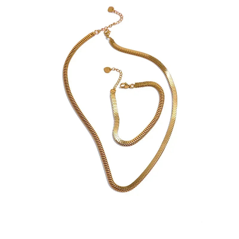 Gold necklace on a white background .