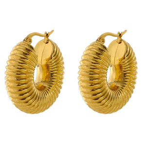 Gold hoop earrings on a white background