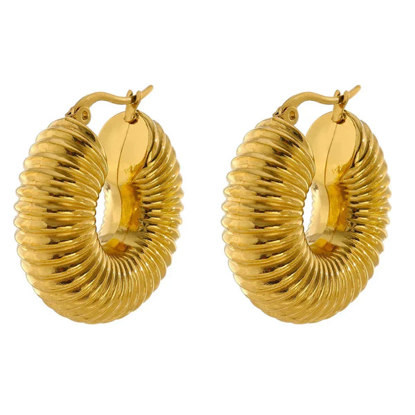 Gold hoop earrings on a white background