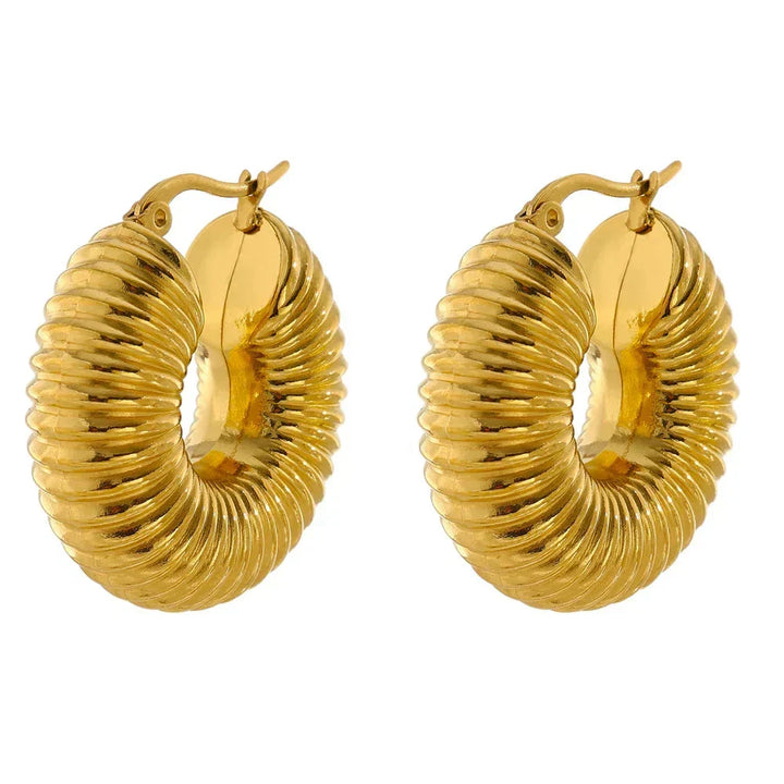 Gold hoop earrings on a white background