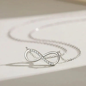 Silver infinity necklace on a light background-Forever Linked Pendant - TM & Co. Jewels
