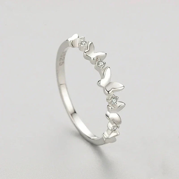 Butterfly Elegance Zircon Ring- TM & CO. JEWELS,butterfly zirconia ring crafted for women who wear elegance with quiet, effortless grace, on a plain background.