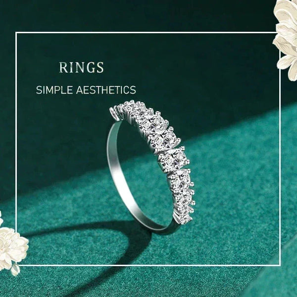 Silver ring with diamonds on a green background