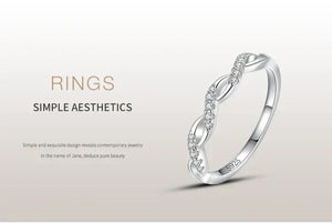 Sterling silver twisted ring with cubic zirconia stones, minimalist elegant design