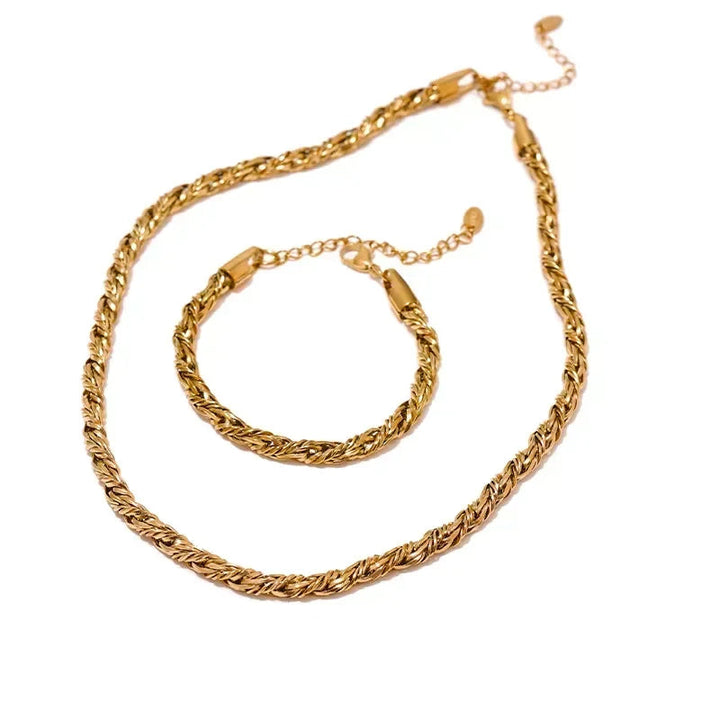 Gold chain necklace and bracelet set on a white background.