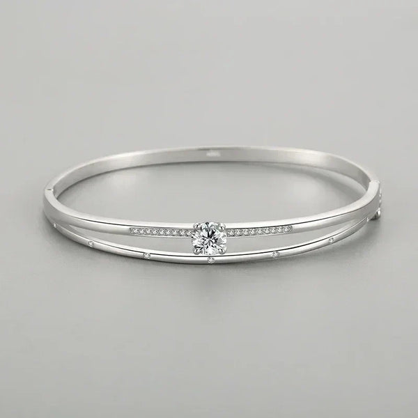 Elegant 925 silver bangle with center round crystal and inset pavé stones, minimalist design