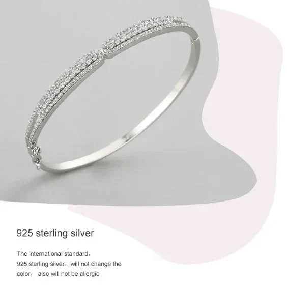Silver bracelet on a light gray background with text about 925 sterling silver.