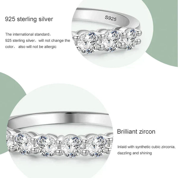 Silver ring with zircon stones on a light green background