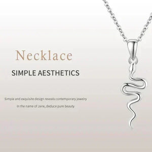 Silver necklace with a modern pendant on a light gray background