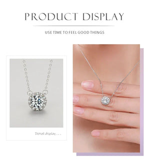 Silver necklace with a diamond pendant on a light gray background.