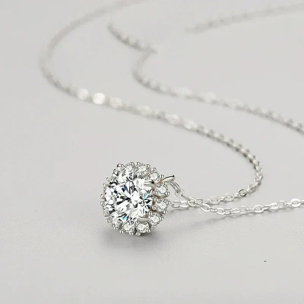 Luminous Circle Sterling Necklace - TM & Co. Jewels-Silver necklace with a round, clear gemstone pendant on a light gray background.