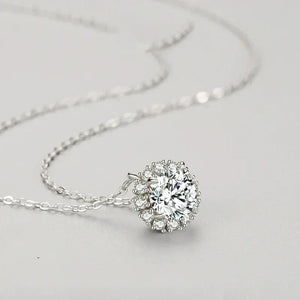 Silver necklace with a large diamond pendant on a light gray background-Luminous Circle Sterling Necklace - TM & Co. Jewels