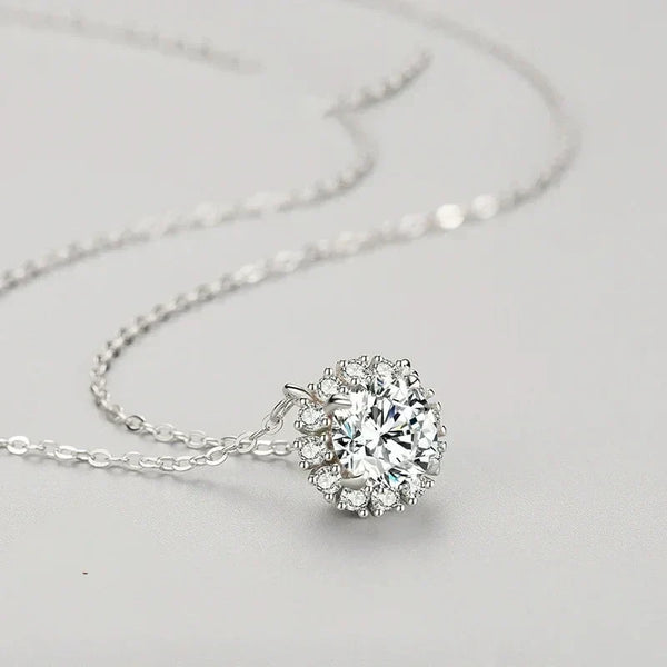 Silver necklace with a large diamond pendant on a light gray background-Luminous Circle Sterling Necklace - TM & Co. Jewels