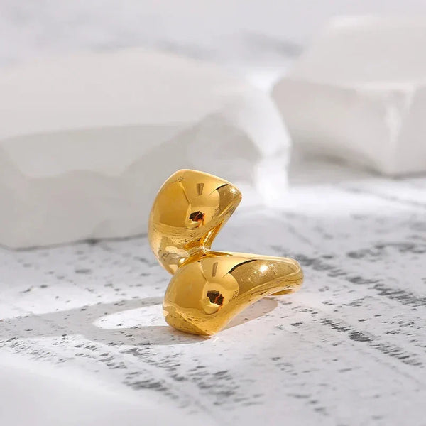 18K gold-plated sculptural open ring for women on white stone background