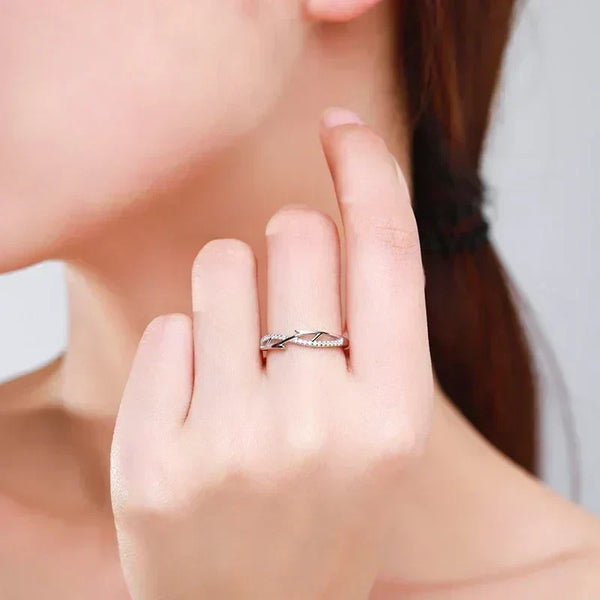 Woman wearing elegant 925 silver twisted band ring with cubic zirconia accents