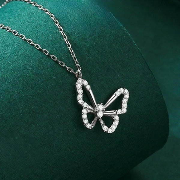 Silver butterfly pendant necklace on a green cushion-Butterfly Elegance Necklace - TM & Co. Jewels