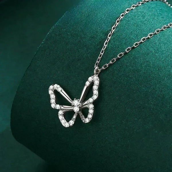 Butterfly Elegance Necklace - TM & Co. Jewels-Butterfly-shaped necklace with diamonds on a green background.