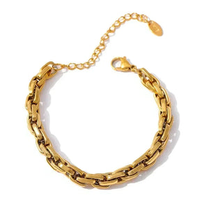 Gold chain bracelet on a white background
