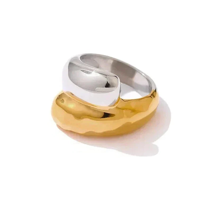 Two-toned gold and silver ring on a white background