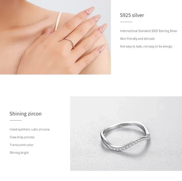 Elegant S925 silver wave ring with cubic zirconia, worn on woman's hand, close-up view