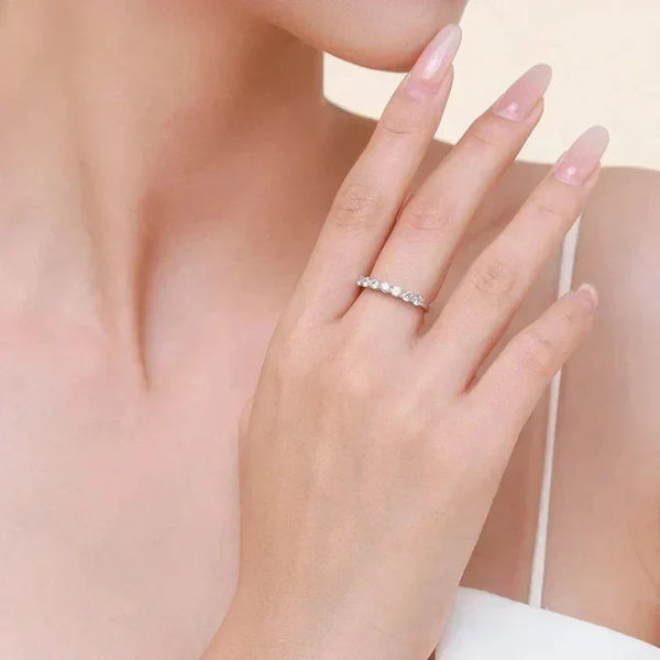 Woman wearing elegant sterling silver gemstone ring on finger