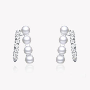 Sterling silver earrings with vertical white pearls and sparkling cubic zirconia accents