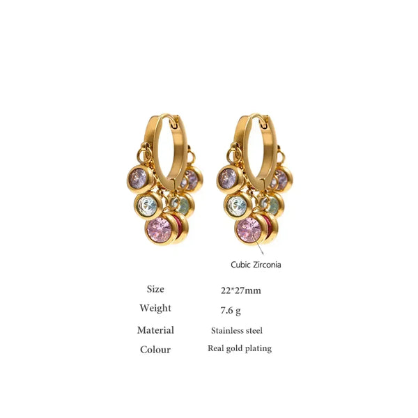 Gold-plated hoop earrings with colorful cubic zirconia charms on white background.