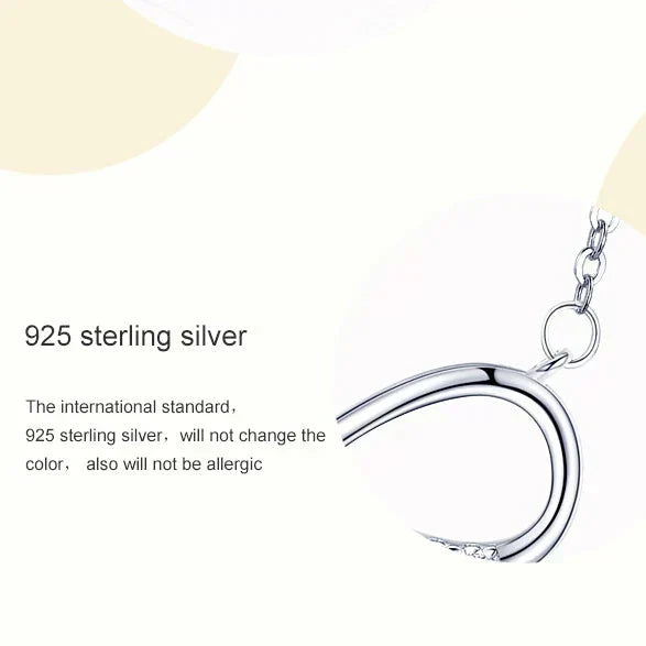 Infinite symbol necklace with zirconia stones on a white background