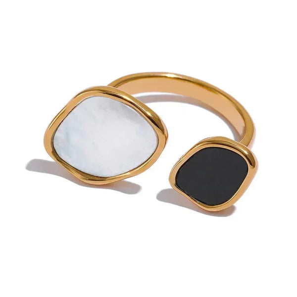 Gold-plated adjustable ring with black and white stone accents, modern jewelry design