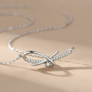 Silver necklace with a delicate design on a beige background-Sleek Geometry Pendant - TM & Co. Jewels.