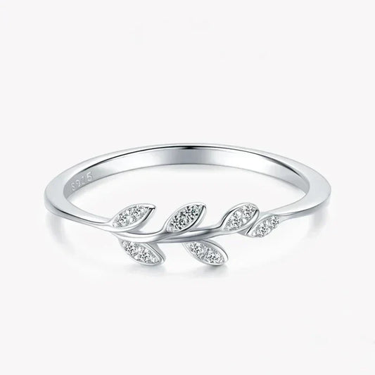 925 silver leaf design ring with sparkling stones on white background