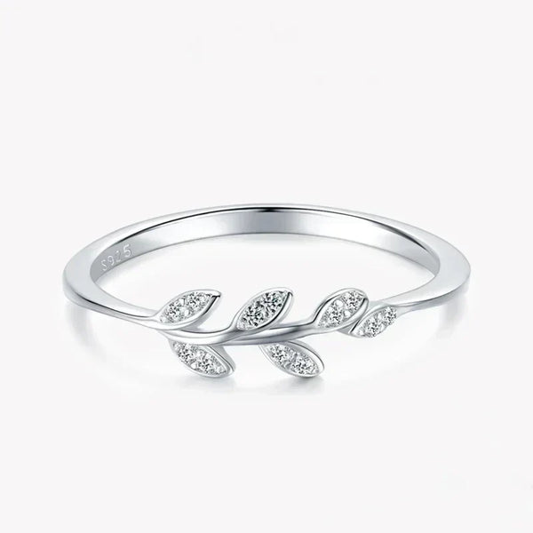 925 silver leaf design ring with sparkling stones on white background